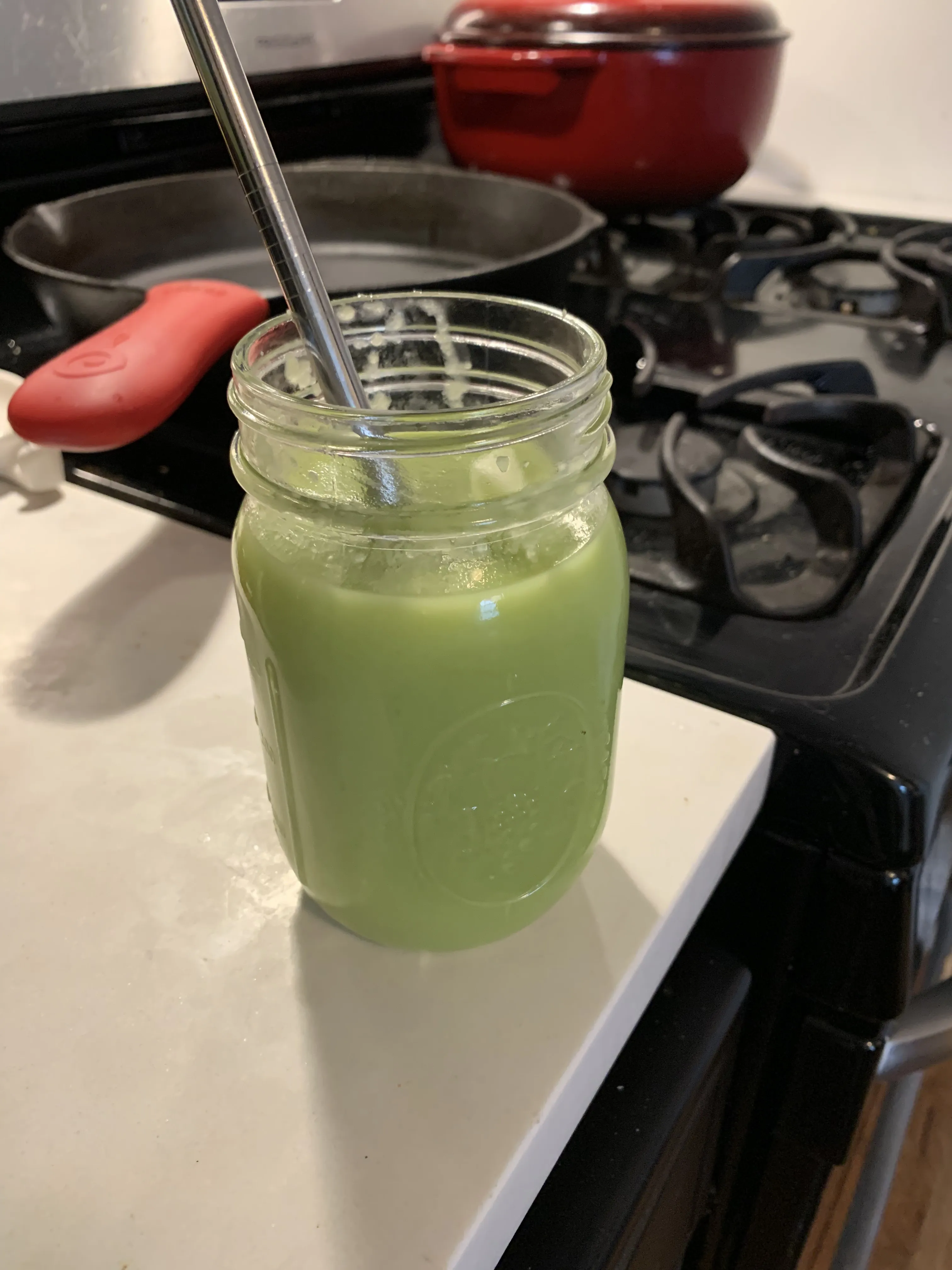 Soup in a mason jar with a spoon